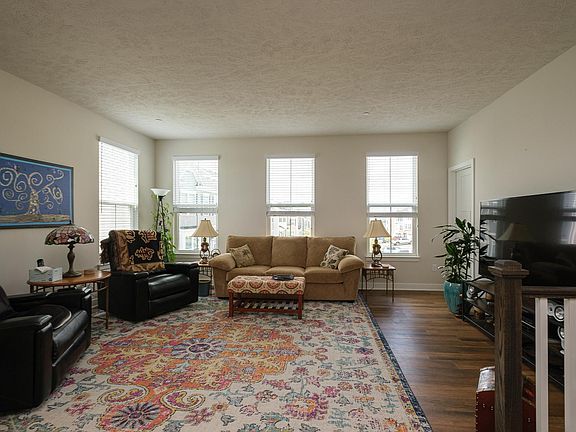 Living room with multiple windows (additional windows being an End Unit)
First floor has LVP throughout
9 feet ceilings