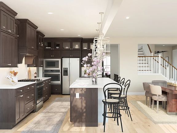 Kitchen with pendant lighting and glass upper cabinets