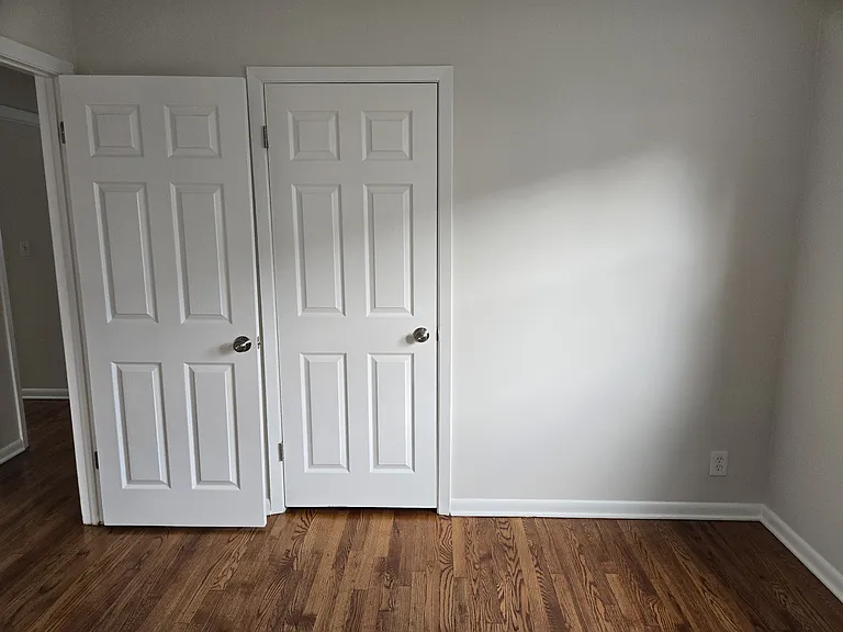 1st bedroom continued with fresh paint and hardwood floors.