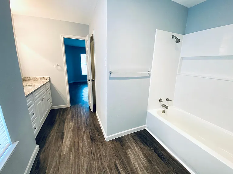 Master bathroom. Open door leads to master bedroom. Door to the right leads to the toilet room, accessible from the living room.