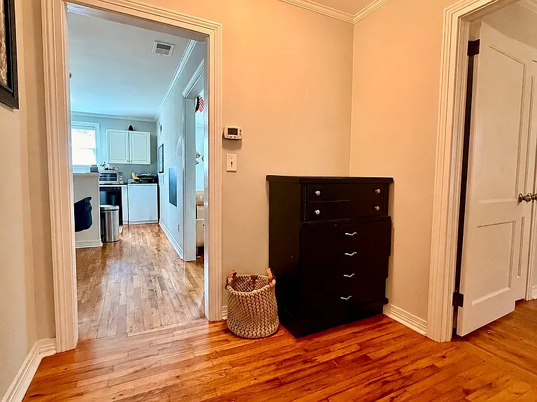 Landing space connecting Bedroom 1, Bedroom 2, and Full bath