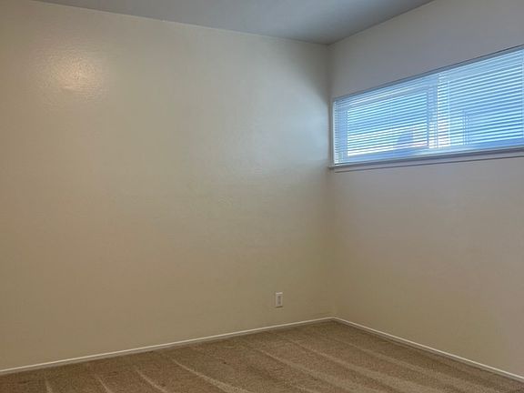 Large bedroom with lots of natural light.