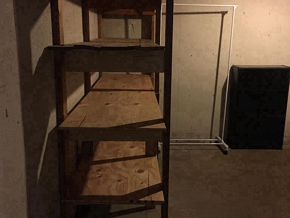 Laundry room with extra storage shelves