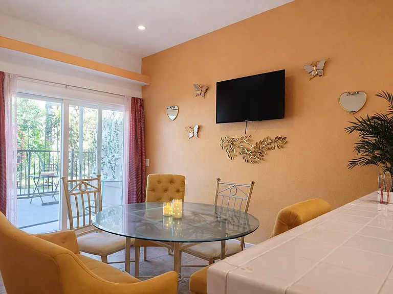 Dining room with gated entrance to the backyard and the pool