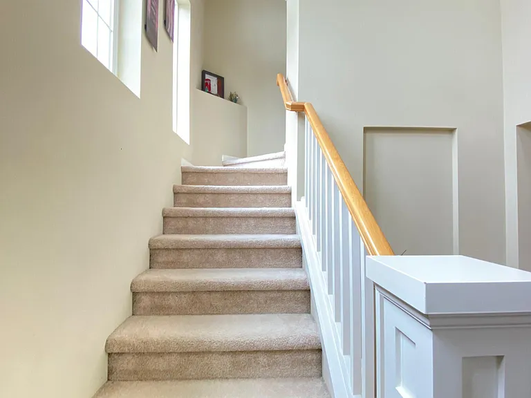 Stairs from the foyer leads to the upper level