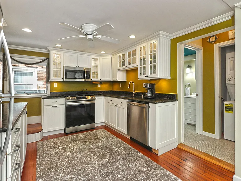 Kitchen with hardwood floors.