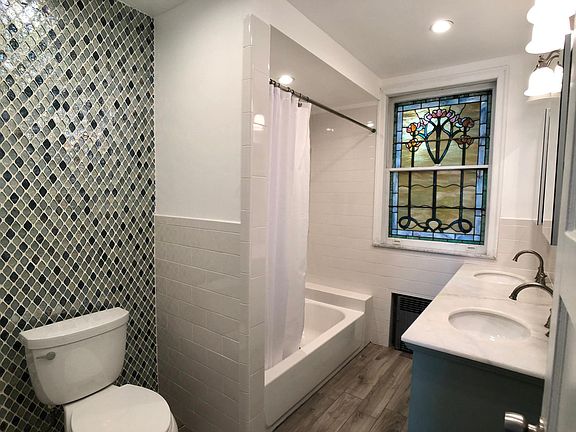 Bathroom with Shower/Bathtub and Double Vanity