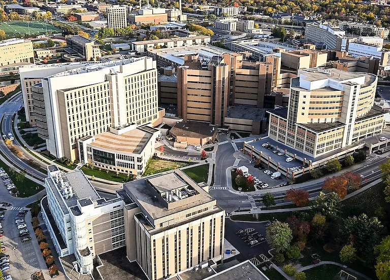 This is the renowned conglomerate of UW Hospital and Clinics (a part of the UW-Madison) at the edge of the beautiful Lake Mendota. It is less than 10 minutes away by car and accessible via a bike path (similar time to reach).