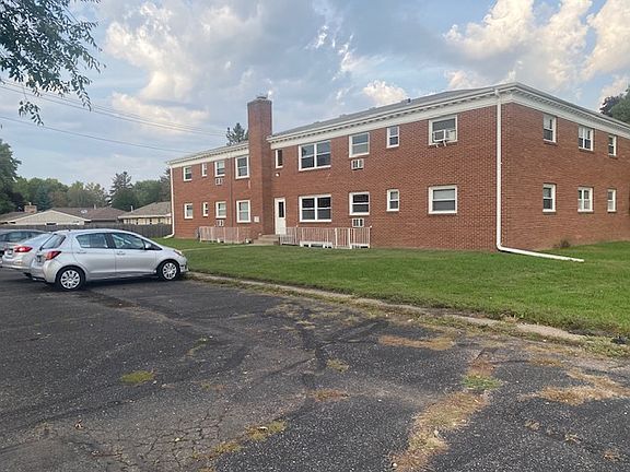 Back of Apartment Building with off street parking.