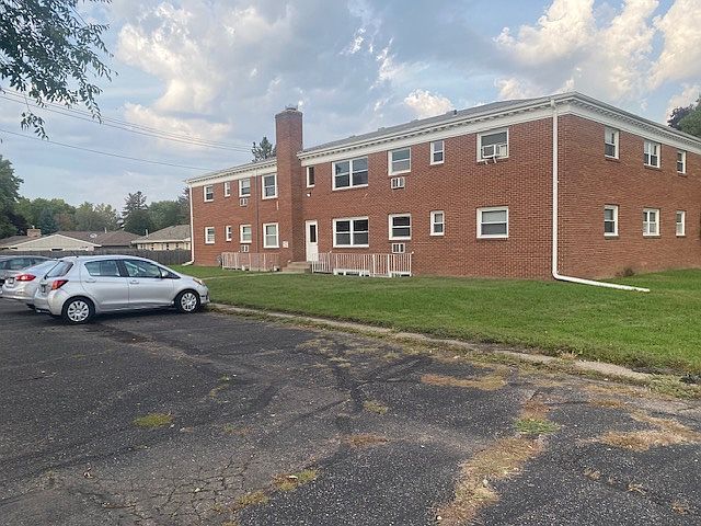 Back of Apartment Building with off street parking.