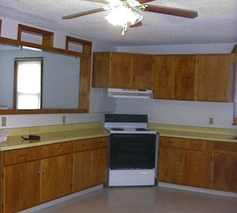 Kitchen looking into living room. Large open view, over the counter.