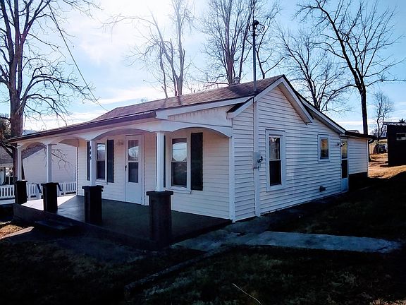 House has a private, paved driveway and sits on a nice lot.