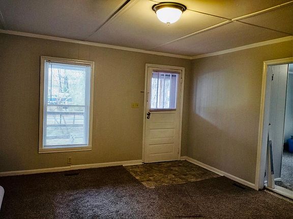 Living room with new carpet , paint and window