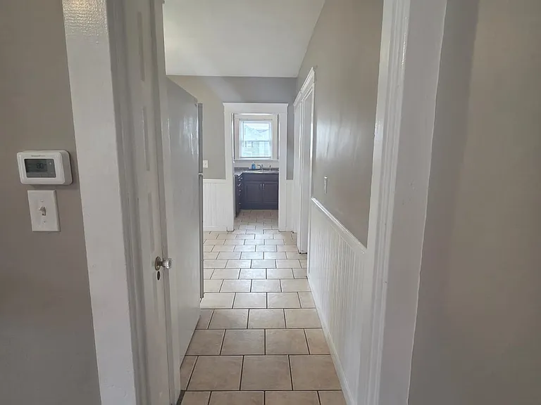 Leading to Kitchen and 2 additional bedrooms and rear entrance