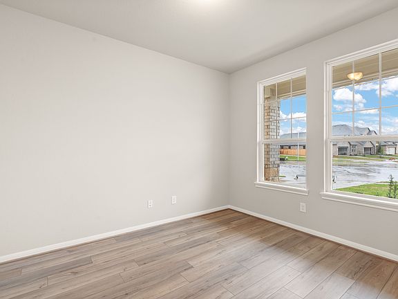 Quietly nestled in the front of the home, the office features French doors, beautiful floor and larg