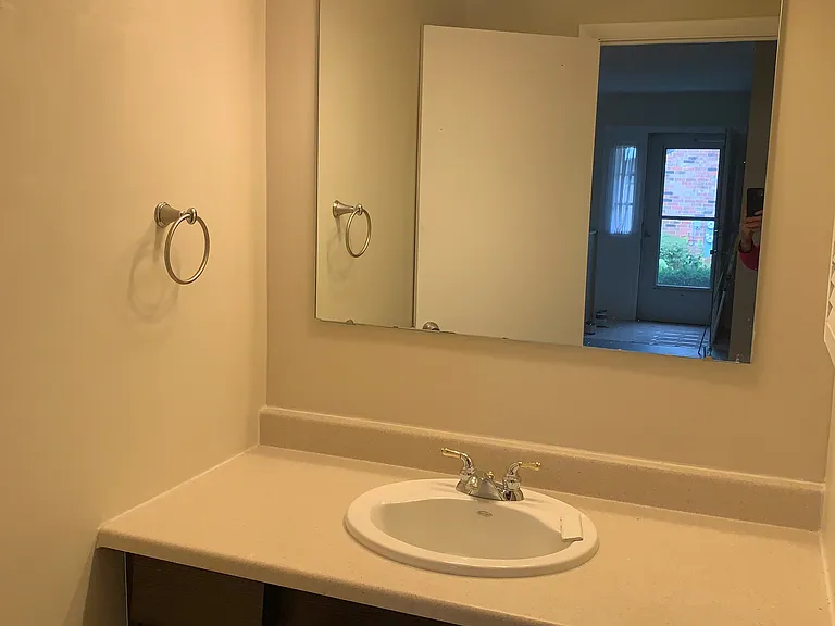 Bathroom w/ sink cabinets, counter space and a medicine cabinet