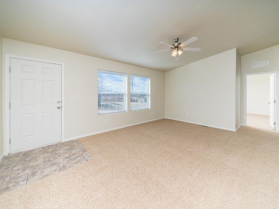 Very open & spacious "great room", kitchen, dining area, & living room.  Lots of windows! vaulted ceilings, 2" faux wood blinds & upgraded lighting.