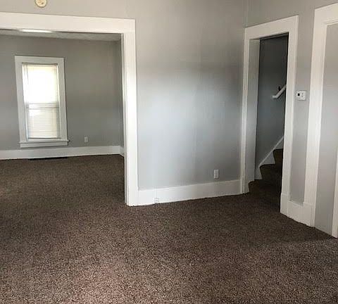 living room area looking into the dining room area
