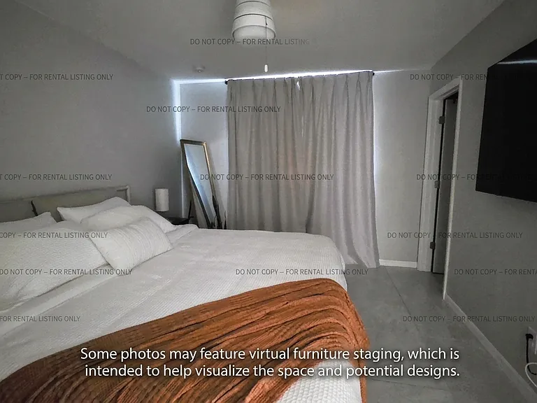 Relax and unwind in this serene master bedroom. This comfortable retreat offers a calming atmosphere, perfect for rest and rejuvenation after a busy day. Enjoy the clean, modern aesthetic and peaceful ambiance of this thoughtfully designed master suite