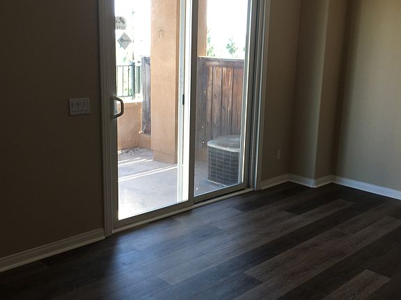 Patio Entrance showing floors before tenant had furniture in dining room