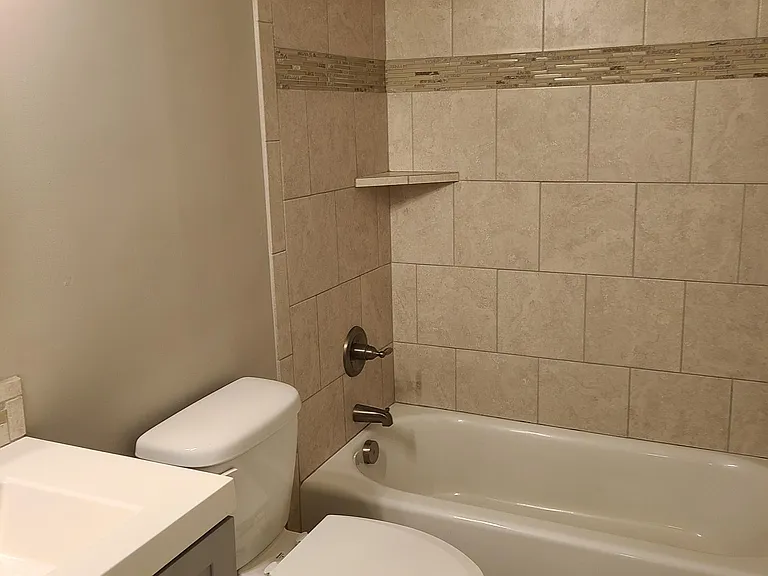 Tile flooring and surround in the bathroom