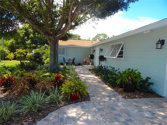 Beautifully landscaped entry path from Driveway and new Garage.