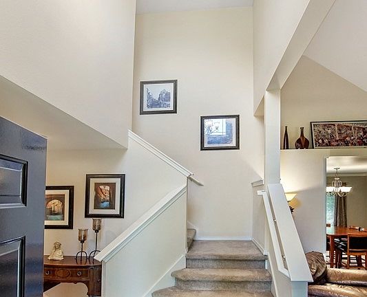 Vaulted ceilings great you upon entry! 