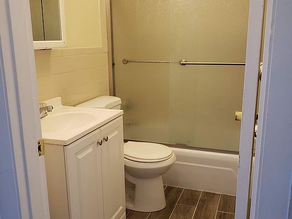 New Tile and glass doors in Bathroom.