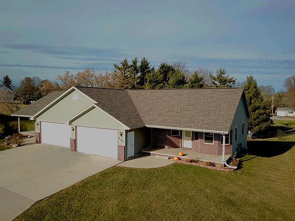 Southern facing driveway allows ample sunlight in kitchen an