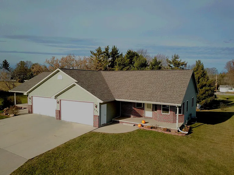 Southern facing driveway allows ample sunlight in kitchen an