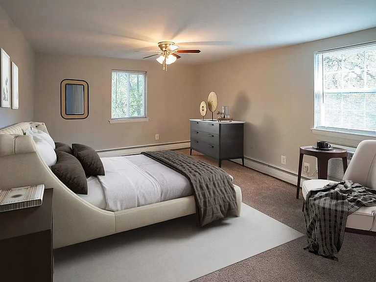 Experience tranquility in this elegant and spacious bedroom designed for relaxation.
