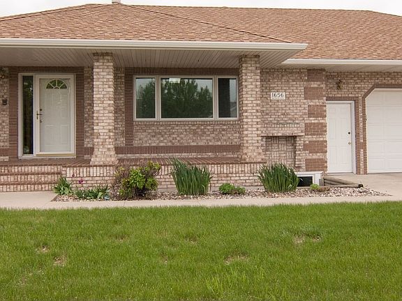 Plant some flowers in the brick flower boxes