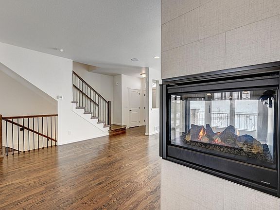 Three sided fireplace that separates the dining room and living room!