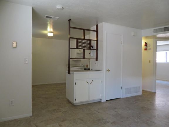 A counter for serving guests beckons you into the kitchen.