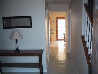 Foyer leads to Open Kitchen/Family Room area and to Living Room/Dining Room