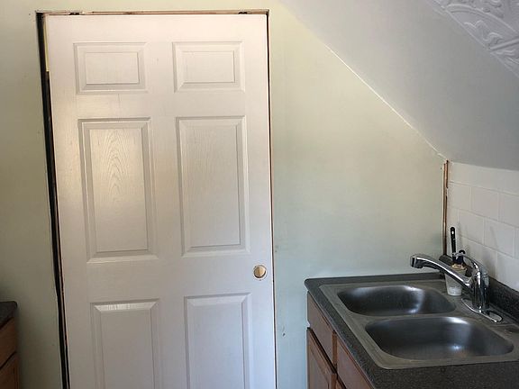 Kitchen facing bathroom with Pocket Door.