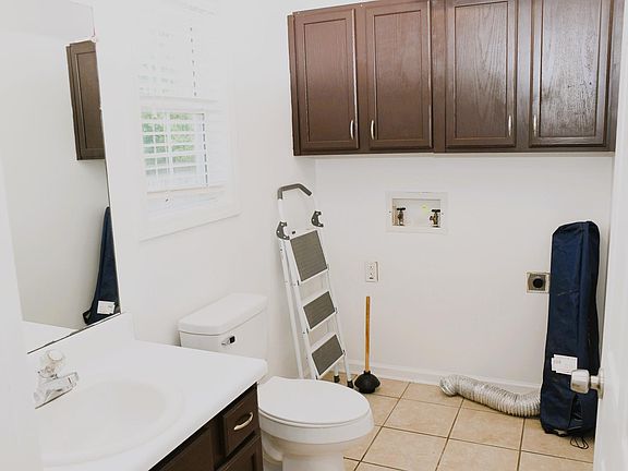 First Floor Half Bath + Laundry Room