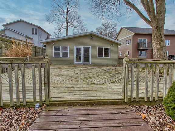 Large deck overlooks lake and large yard