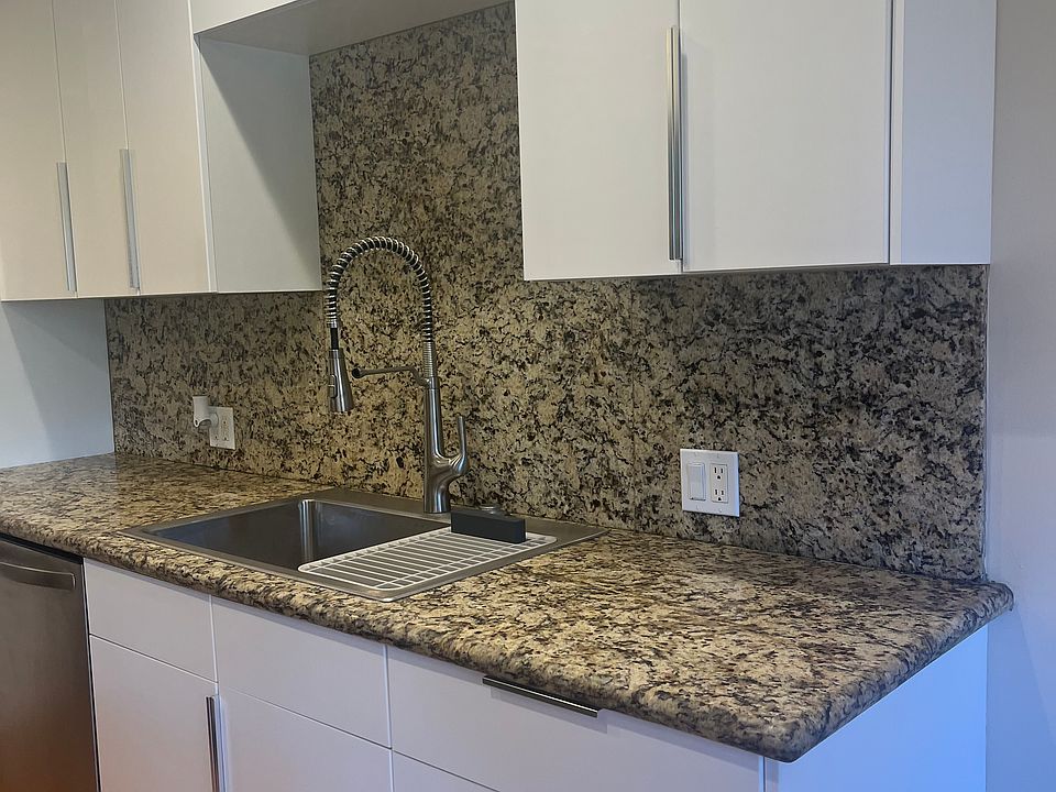 GRANITE COUNTERTOPS & LARGE DOUBLE SIDED STAINLESS STEEL SINK WITH MODERN SPRAY FAUCET
