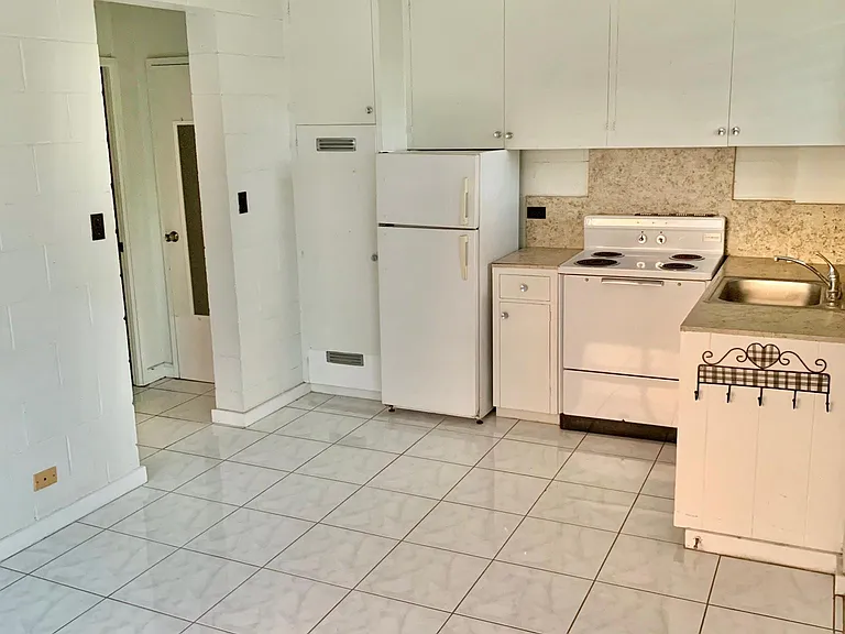 View from living room, to the kitchen, to the bathroom