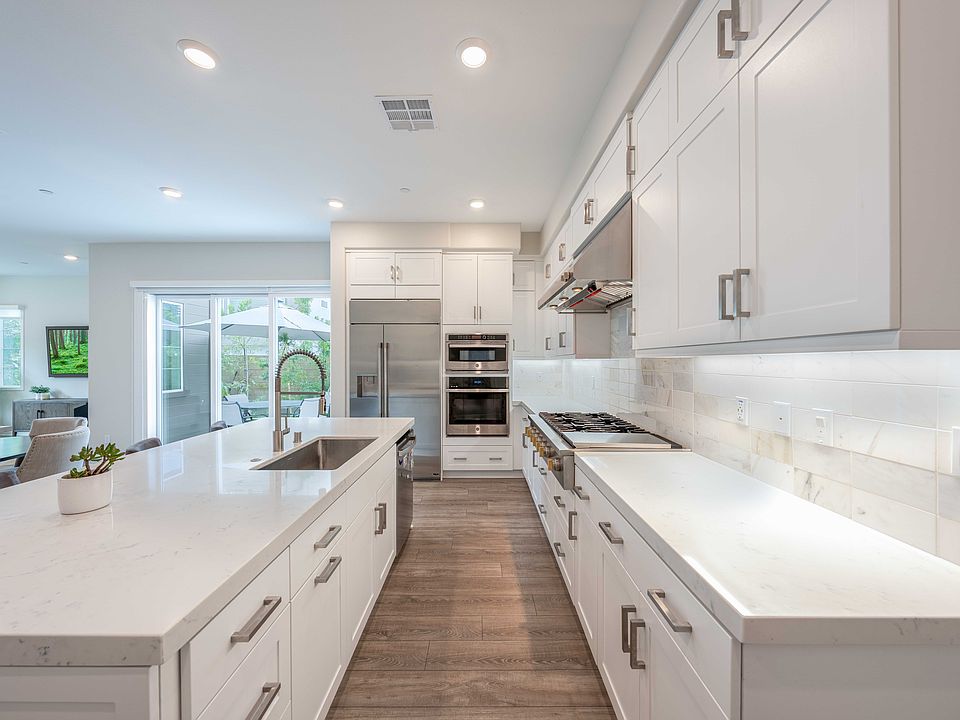 Beautifully upgraded backsplash, GE Monogram appliances. And massive walk-in pantry