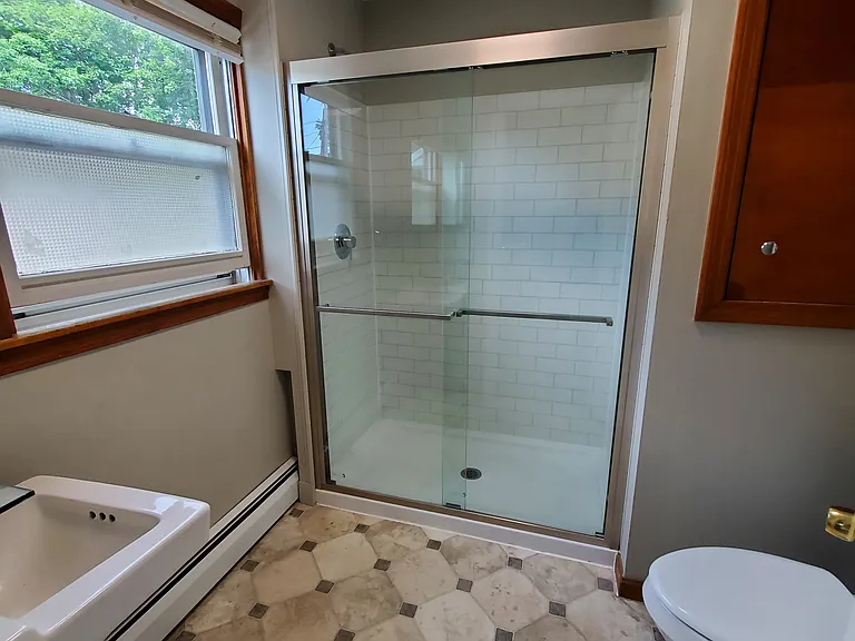 Walk in shower. The linen closet is on the right of the photo.