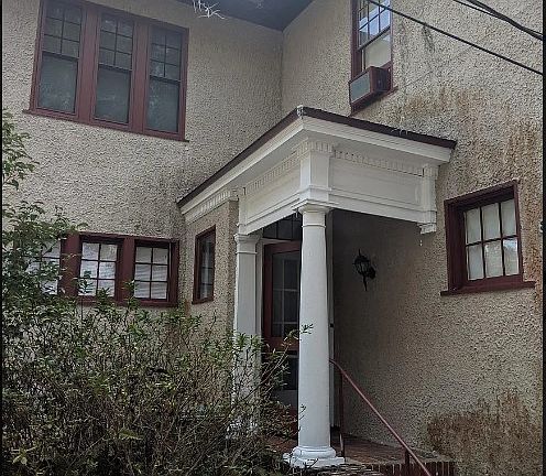 Entrance to apartment. (Older photo. Walls have since been pressure washed.)