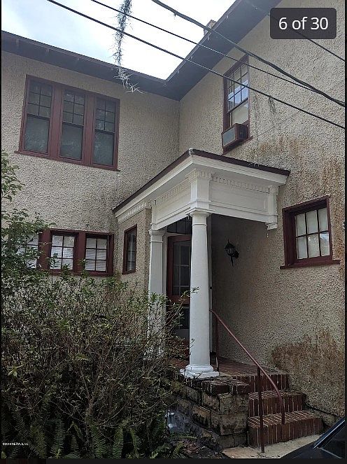 Entrance to apartment. (Older photo. Walls have since been pressure washed.)