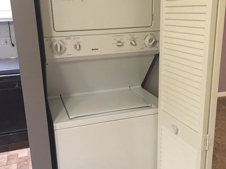 Built-in laundry unit that was recently installed (open)