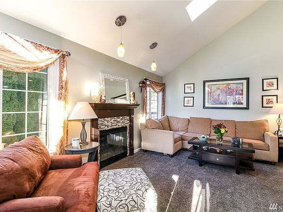 The first floor has a wonderful circular floor plan. In the living room, the gas log fireplace adds cozy ambiance on cold winter nights.