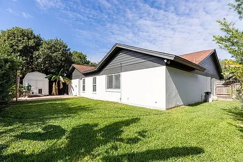 Spacious, private back yard with large shed and patio.