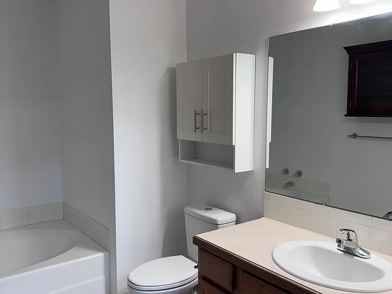 Large bathroom with a garden tub and a separate shower stall.
