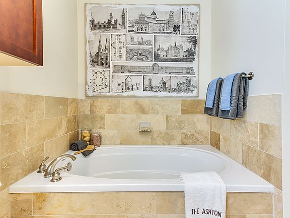 Spa-inspired soaking tub in spacious luxury bathrooms