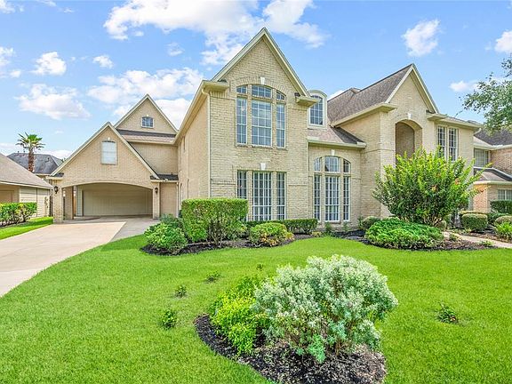 Drive up to a 2 car garage and full 2 car carport.